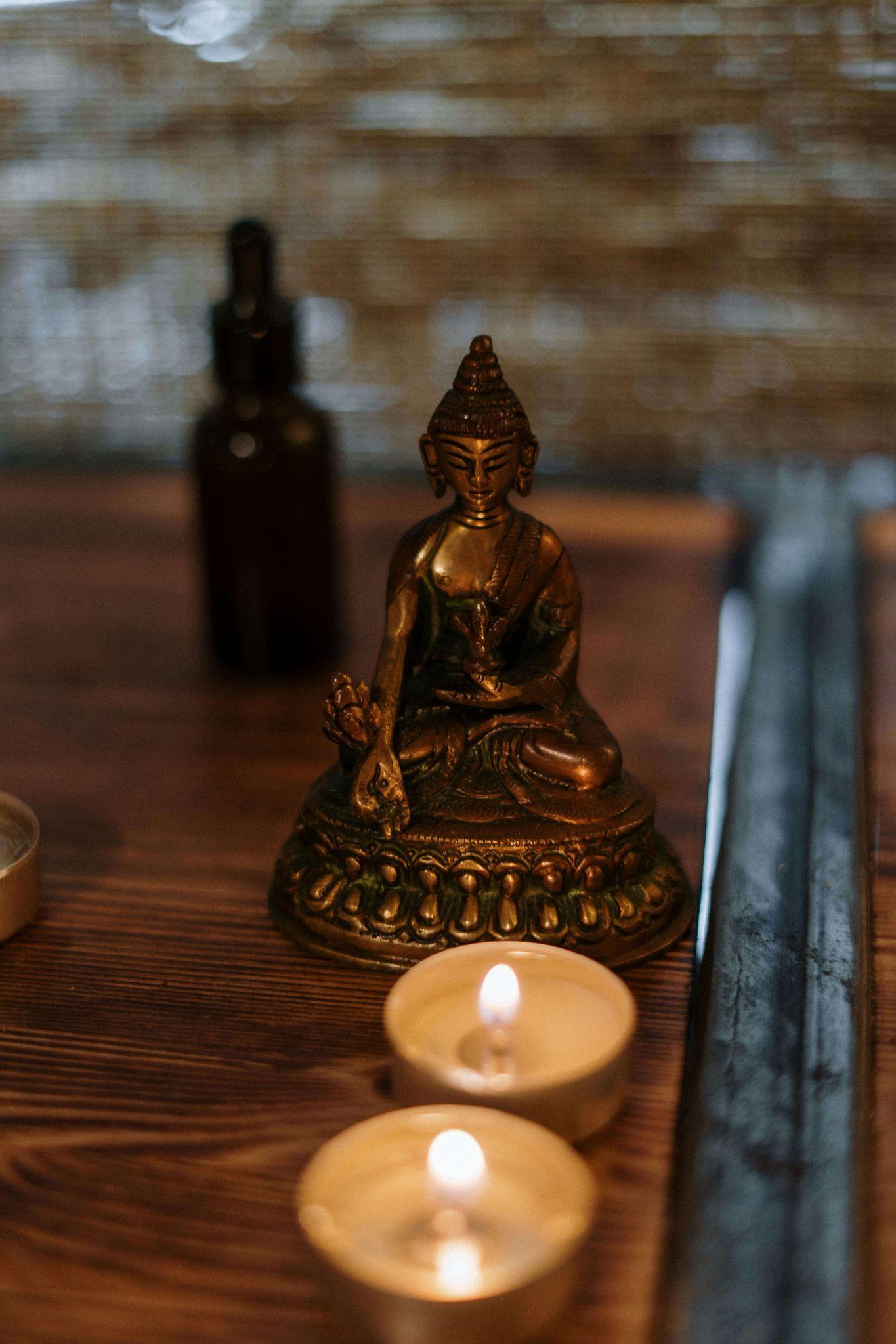 buddha statue with candles