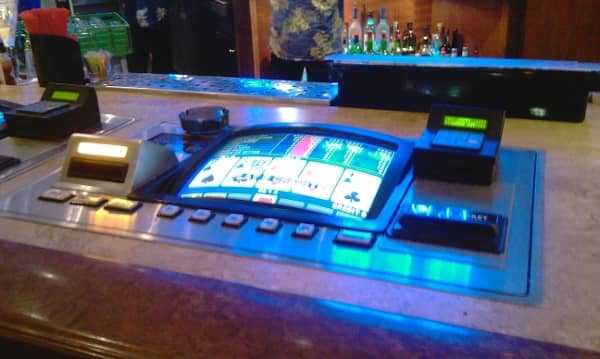 A slot machine located at a bar A slot machine located at a bar