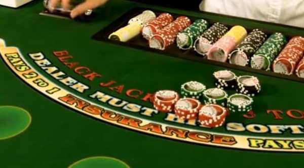 The dealer hands the cut card to the player on a single deck game The dealer hands the cut card to the player on a single deck game