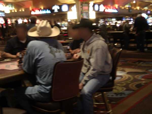 A few cowboys playing roulette A few cowboys playing roulette