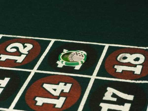 A large stack of chips is on one number on roulette A large stack of chips is on one number on roulette