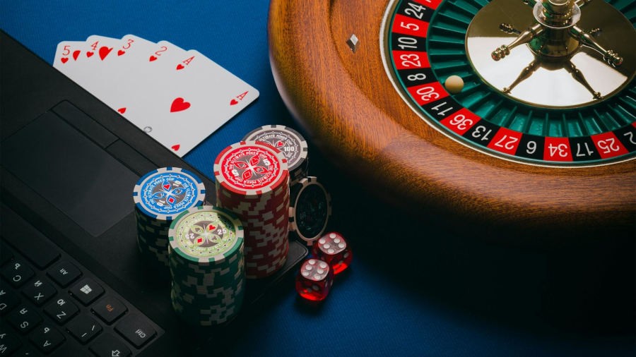 roulette wheel with casino chips around it