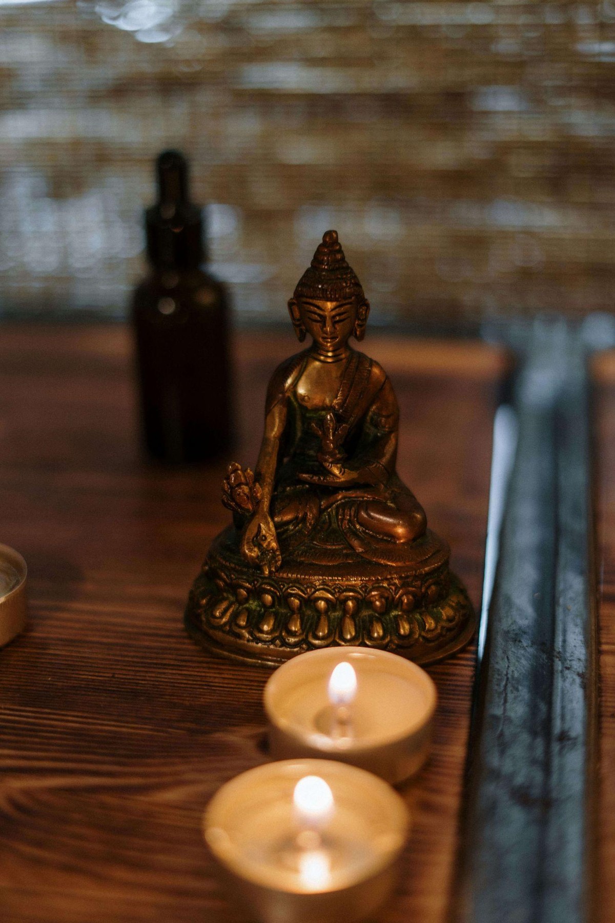 buddha statue with candles
