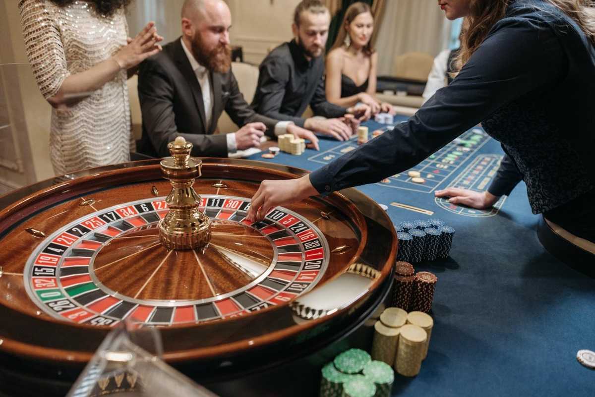 a player placing a roulette token a player placing a roulette token